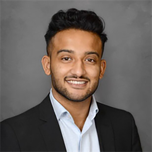 Portrait headshot close-up photograph view of Niam Vora smiling